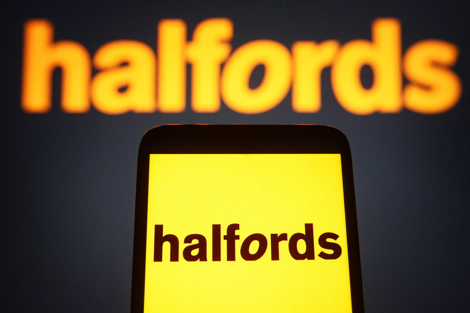 In this photo illustration, Halfords Group PLC logo is seen on a smartphone and a pc screen. (Photo by Pavlo Gonchar / SOPA Images/Sipa USA)
