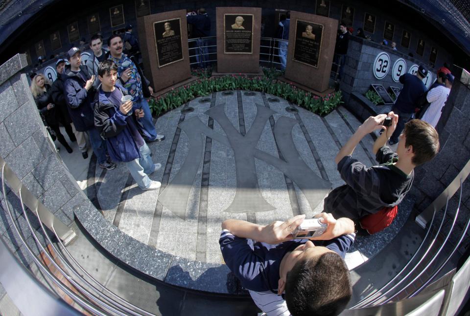 Baseball fans stop to take pictures inside Monument Park.