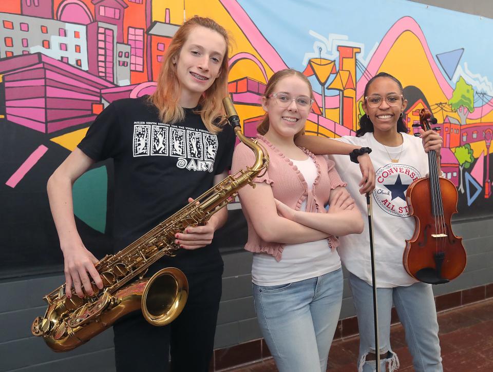 Miller South students Luca Ratay, left, Tessa Patton, and Jordin Vaughn at the Akron school.