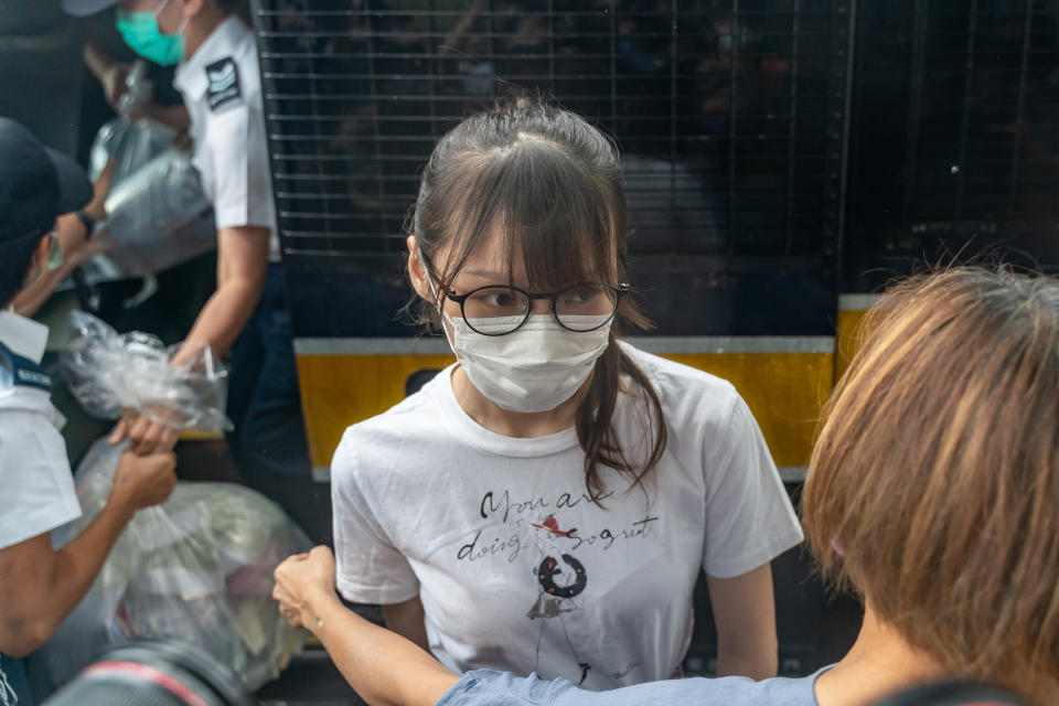 HONG KONG, CHINA - JUNE 12: Hong Kong pro-democracy activist Agnes Chow steps out of a Hong Kong Correctional Services vehicle after being released from the Tai Lam Correctional Institution in Tuen Mun district on June 12, 2021 in Hong Kong, China. Chow was released from prison on Saturday after serving nearly seven months for her role in an unauthorised assembly during the city's 2019 anti-government protests.(Photo by Anthony Kwan/Getty Images)