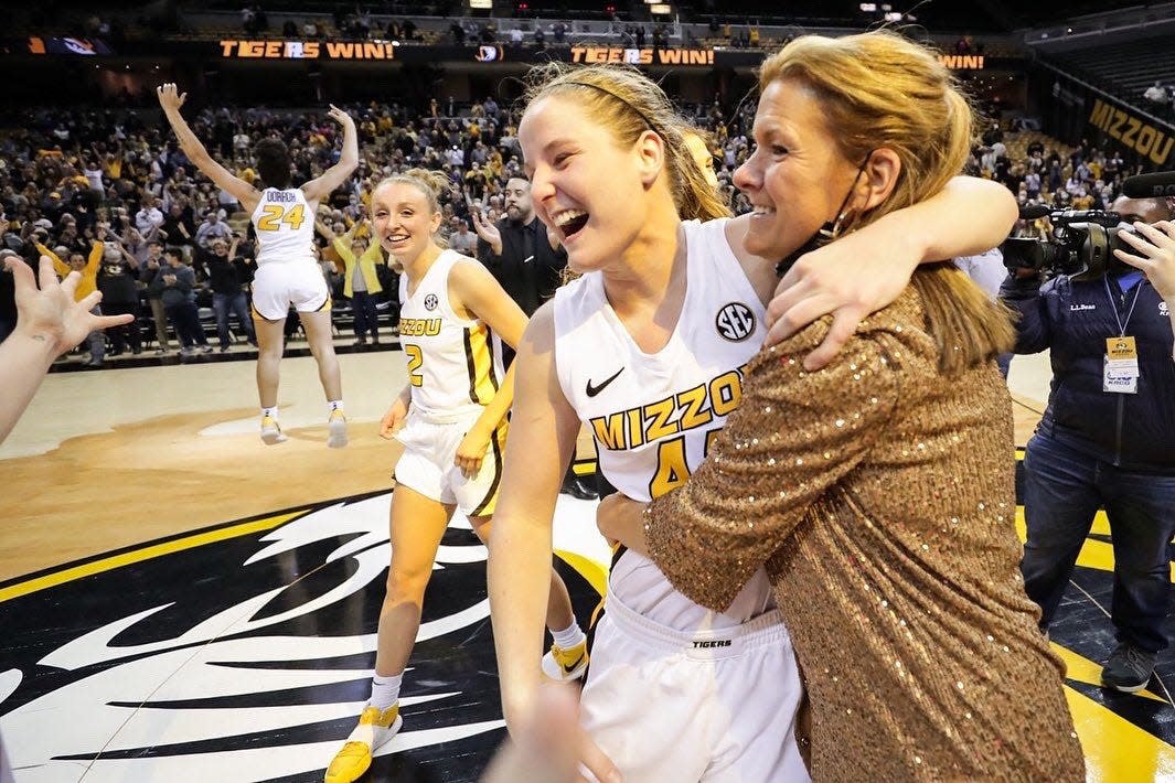 Missouri women's basketball coach Robin Pingeton, right, hugs forward Hayley Frank (43) after beating No. 1 South Carolina on Dec. 30 at Mizzou Arena.