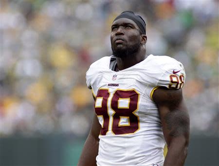 Washington Redskins linebacker Brian Orakpo takes a moment in the final seconds of their NFL football game against the Green Bay Packers in Green Bay, Wisconsin September 15, 2013. REUTERS/Darren Hauck