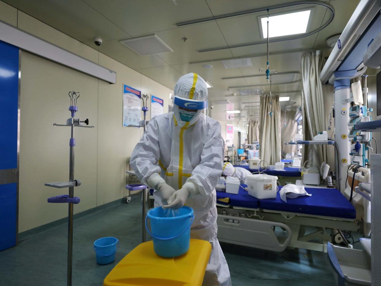 Medical workers in protective suits disinfect an intensive care unit (ICU) ward of Union Jiangbei Hospital in Wuhan: REUTERS