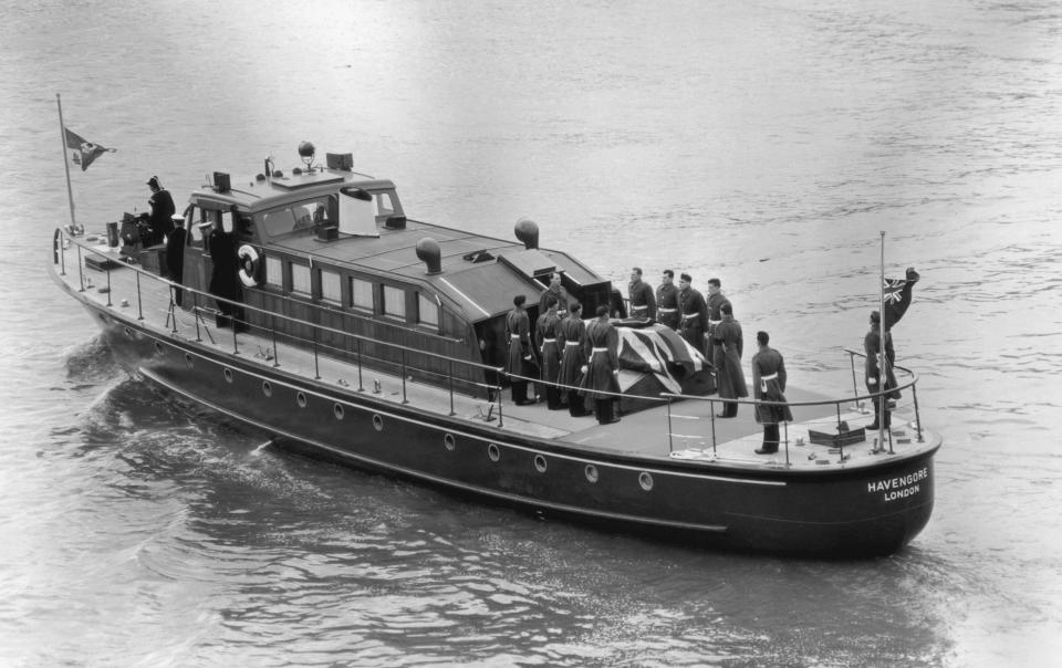 Churchill’s coffin is transported on the Havengore following his state funeral at St Paul’s cathedral in 1965