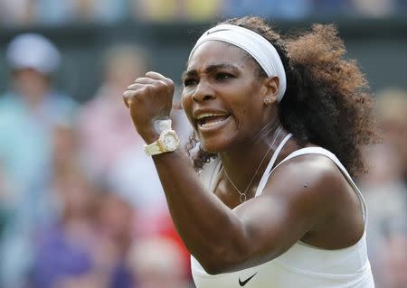 Serena Williams of the U.S.A. celebrates winning a game during her match against Heather Watson of Britain at the Wimbledon Tennis Championships in London, July 3, 2015. REUTERS/Suzanne Plunkett