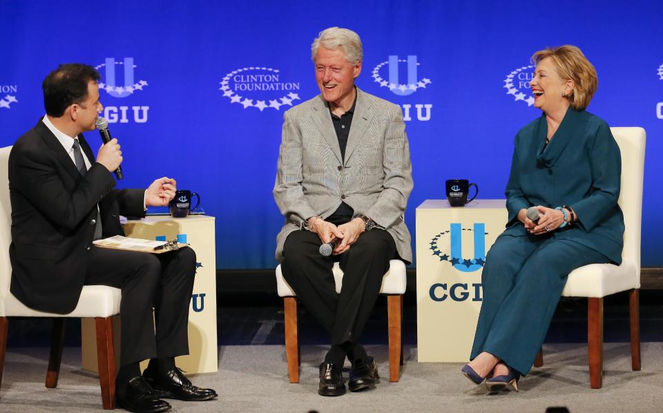 Former President Bill Clinton, center, former Secretary of State Hillary Rodham Clinton, right, speak with talk show host Jimmy Kimmel during a student conference for the Clinton Global Initiative University, Saturday, March 22, 2014, at Arizona State University in Tempe, Ariz. More than 1,000 college students are gathered at Arizona State University this weekend as part of the Clinton Global Initiative University's efforts to advance solutions to pressing world challenges. (AP Photo/Matt York)