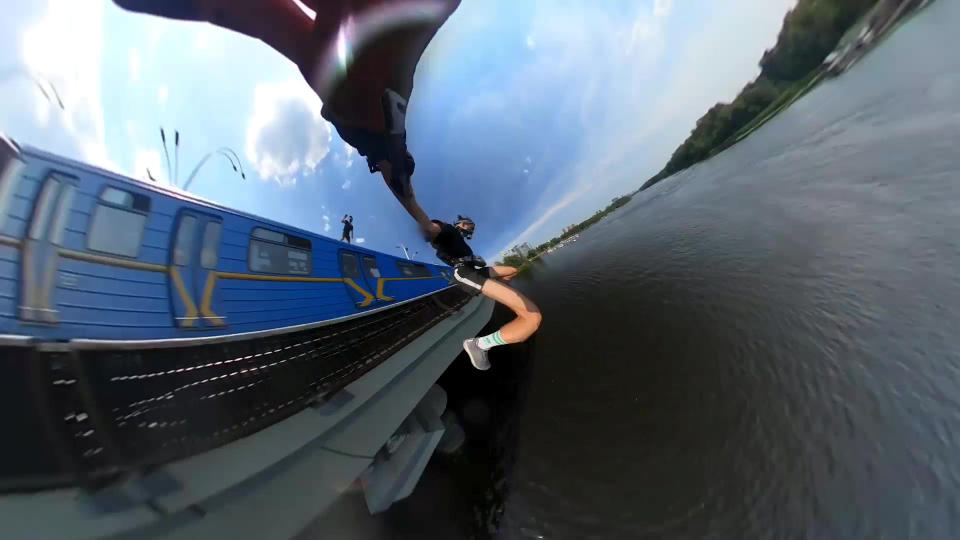 This heart-stopping footage shows a daredevil jumping from a speeding train into a river below. Yaro Panchenko, 18, is seen 'surfing' the subway car as it moves through his home town of Kiev in the Ukraine on August 1 this year. Not content with just surfing the train, Yaro then leaps from the carriage as it crosses a bridge into the water below. However, it didn't go entirely to plan as his Go Pro camera hit him in the face on impact and knocked out a tooth.