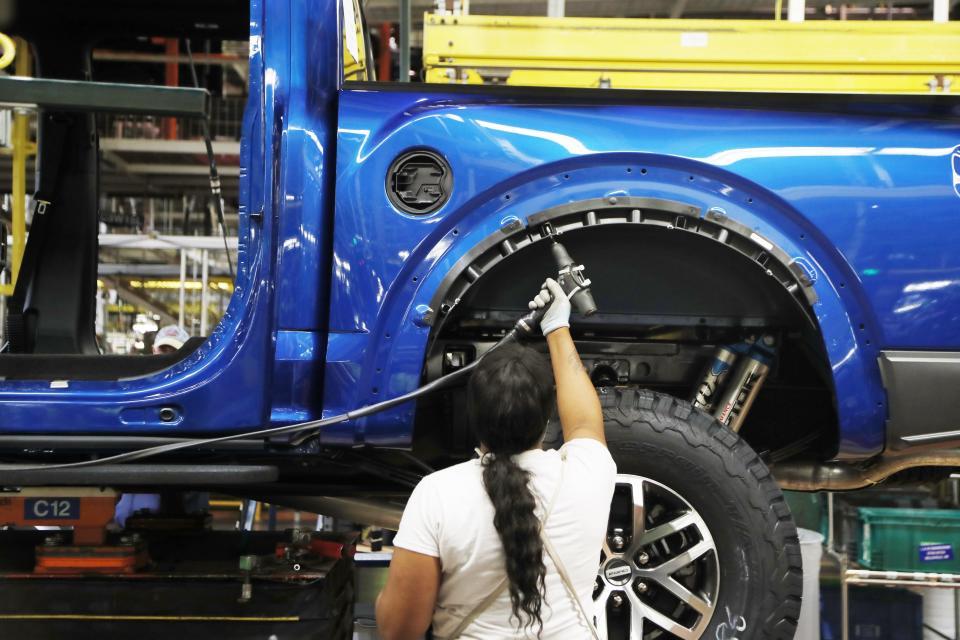 In this Sept. 27, 2018, file photo a United Auto Workers assemblyman works on a 2018 Ford F-150 truck being assembled at the Ford Rouge assembly plant in Dearborn, Mich. (AP Photo/Carlos Osorio, File)