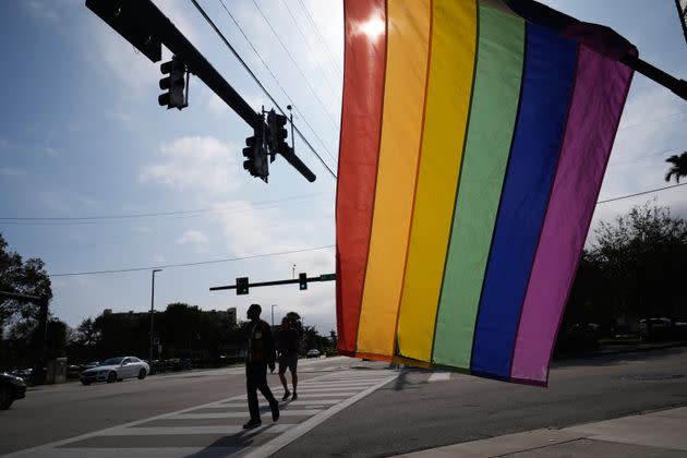 A rainbow LGBTQ+ pride flag hangs outside a business down the block from the Wilton Manors city hall, which sometimes flies a rainbow flag from its facade.A bill moving forward in the Florida State House would ban the display of any flag deemed political in government buildings. The legislation is seen as another anti-LGBTQ+ bill in a state that has passed several under Republican Gov. Ron DeSantis. 