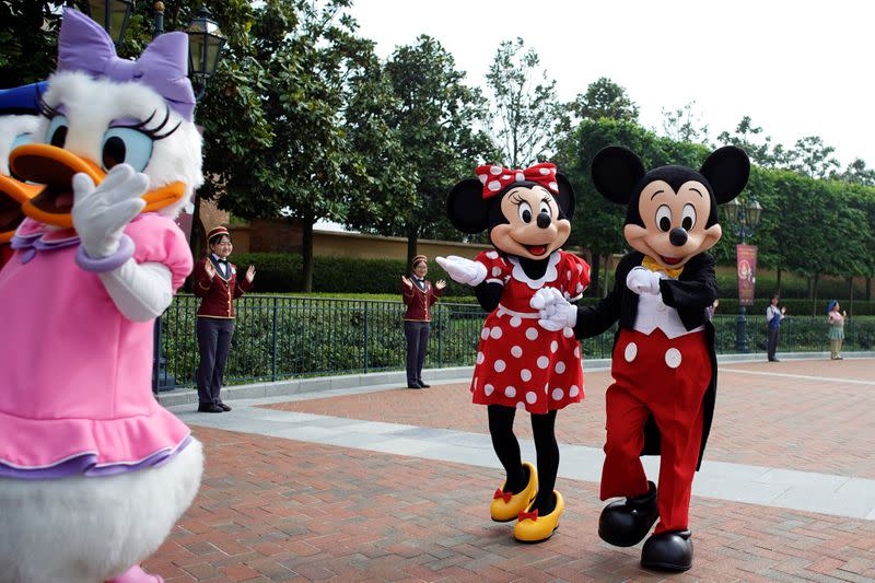 Disney characters Mickey Mouse and Minnie Mouse greet visitors at Shanghai Disney Resort as the Shanghai Disneyland theme park reopens following a shutdown due to the coronavirus disease (COVID-19) outbreak, in Shanghai