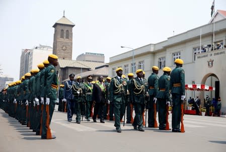 Zimbabwe's President Emmerson Mnangagwa arrives to officially open a new parliament session as well as deliver his State of the Nation address at Parliament Building in Harare