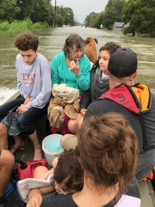 Tim Miller&rsquo;s granddaughter Natalie (front right), with other members of her family boating to safety in the aftermath of Harvey. (Photo: TIM MILLER/TEXAS EQUUSEARCH)