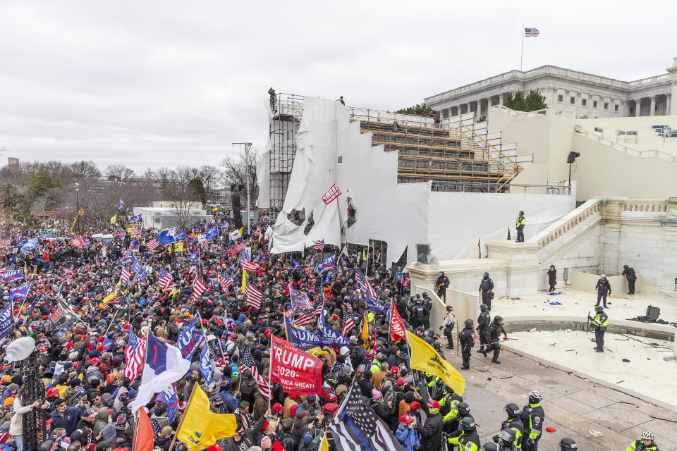 WASHINGTON DC, DISTRICT OF COLUMBIA, UNITED STATES - 2021/01/06: Pro-Trump protesters seen on and around Capitol building. Rioters broke windows and breached the Capitol building in an attempt to overthrow the results of the 2020 election. Police used battons and tear gas grenades to eventually disperse the crowd. Rioters used metal bars and tear gas as well against the police. (Photo by Lev Radin/Pacific Press/LightRocket via Getty Images)