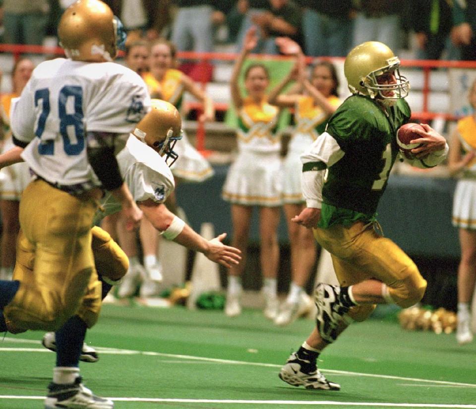 -Vestal quarterback Mike Young runs in a 4th quarter touchdown to put the Golden Bears up 12-11 over Queensbury. Vestal went on to win the 1997 Class A State Championship, 14-11.