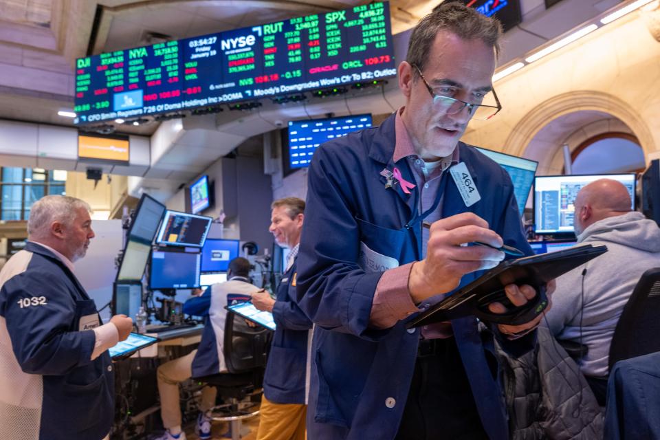 Traders work on the floor of the New York Stock Exchange (NYSE) on January 19, 2024 in New York City.