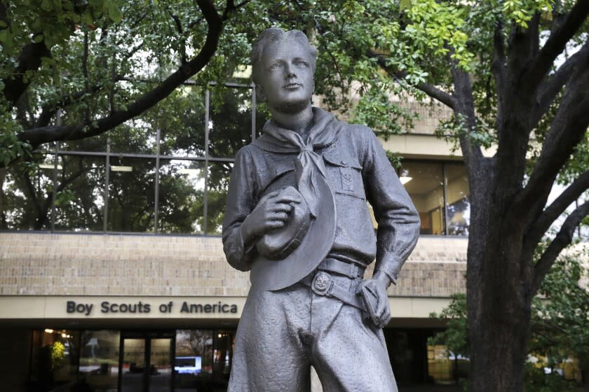 FILE - In this Feb. 12, 2020 file photo, a statue stands outside the Boys Scouts of America headquarters in Irving, Texas. Close to 90,000 sex-abuse claims have been filed against the Boy Scouts of America as the deadline arrived Monday, Nov. 16 for filing claims in the BSA's bankruptcy case. The number far exceeded initial projections of lawyers across the United States who have been signing up clients in the case since the Boy Scouts filed for bankruptcy protection in February in the face of hundreds of lawsuits. (AP Photo/LM Otero, File)