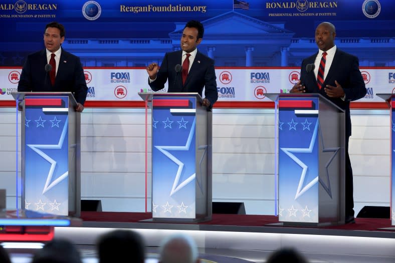 (Left to right) Republican presidential candidates Florida Gov. Ron DeSantis, Vivek Ramaswamy and U.S. Sen. Tim Scott (R-SC) participate in the FOX Business Republican Primary Debate at the Ronald Reagan Presidential Library on Sept. 27, 2023, in Simi Valley, California. Seven presidential hopefuls squared off in the second Republican primary debate as former U.S. <span class="caas-xray-inline-tooltip"><span class="caas-xray-inline caas-xray-entity caas-xray-pill rapid-nonanchor-lt" data-entity-id="Donald_Trump" data-ylk="cid:Donald_Trump;pos:4;elmt:wiki;sec:pill-inline-entity;elm:pill-inline-text;itc:1;cat:Politician;" tabindex="0" aria-haspopup="dialog"><a href="https://search.yahoo.com/search?p=Donald%20Trump" data-i13n="cid:Donald_Trump;pos:4;elmt:wiki;sec:pill-inline-entity;elm:pill-inline-text;itc:1;cat:Politician;" tabindex="-1" data-ylk="slk:President Donald Trump;cid:Donald_Trump;pos:4;elmt:wiki;sec:pill-inline-entity;elm:pill-inline-text;itc:1;cat:Politician;" class="link ">President Donald Trump</a></span></span>, currently facing indictments in four locations, declined again to participate. (Photo by Justin Sullivan/Getty Images)