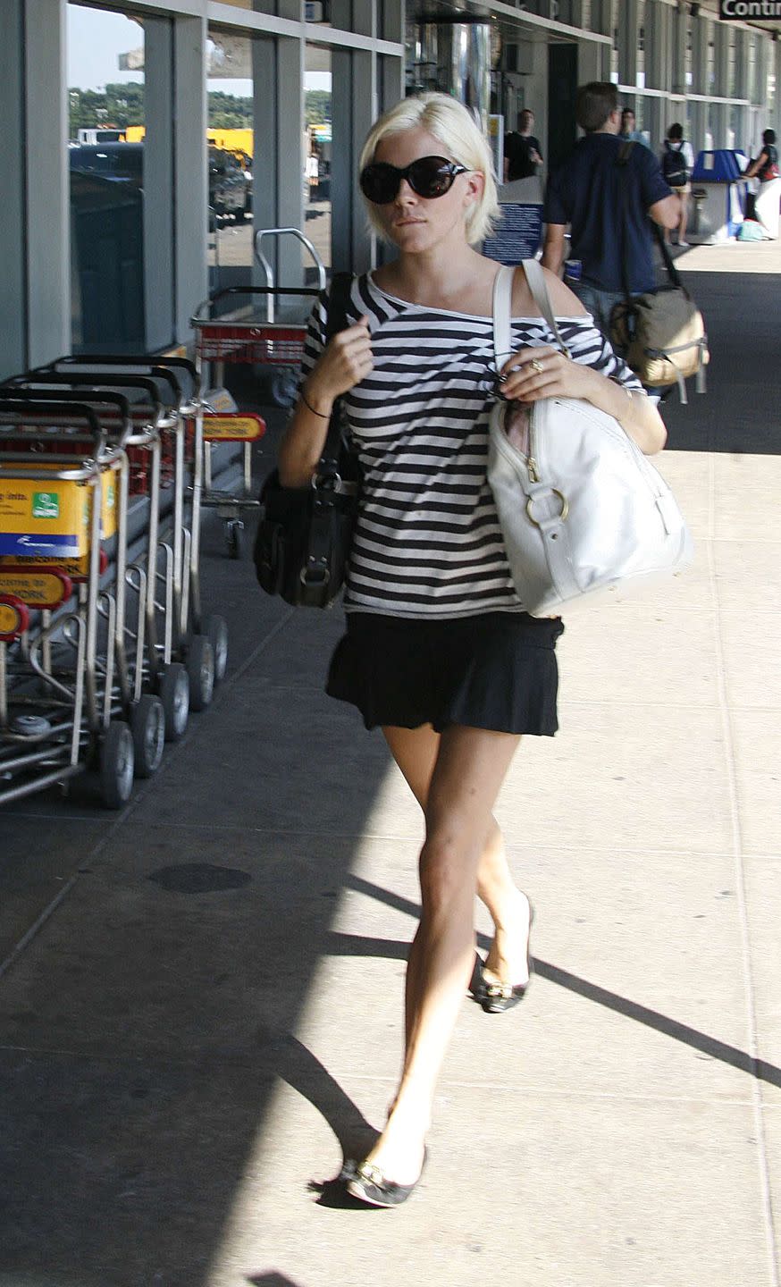 <p>Sienna Miller arrives at LaGuardia Airport in New York City in a black and white outfit in 2006. </p>