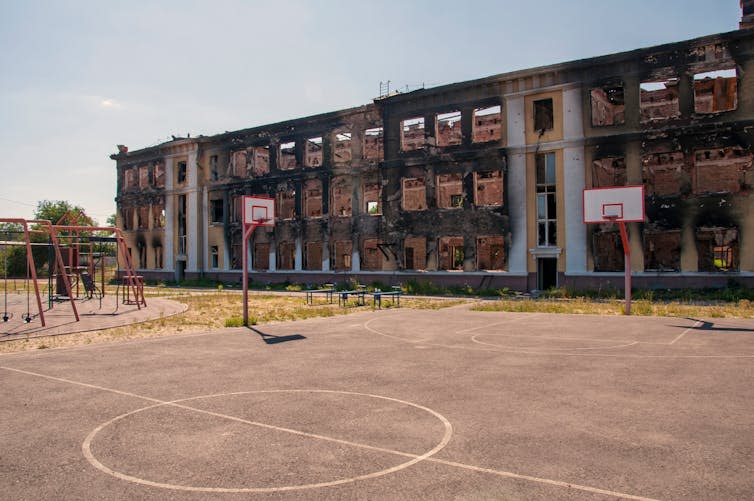 Bombed out school viewed from the play ground.