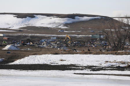 Authorities clear the Oceti Sakowin camp in Cannon Ball, North Dakota, U.S., February 24, 2017. REUTERS/Stephen Yang