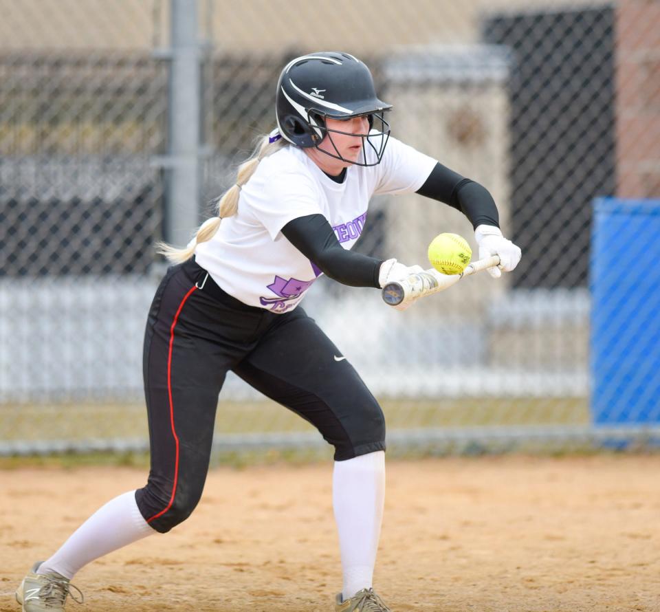 ROCORI junior Jenna Boos bunts the ball Thursday, April 28, 2022, at ROCORI High School in Cold Spring. 