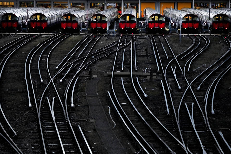 Piccadilly line trains sit in their depot as members of the Rail, Maritime and Transport union (RMT) continue with nationwide strikes in a bitter dispute over pay, jobs and conditions in London, Friday, Aug. 19, 2022. (AP Photo/Frank Augstein)