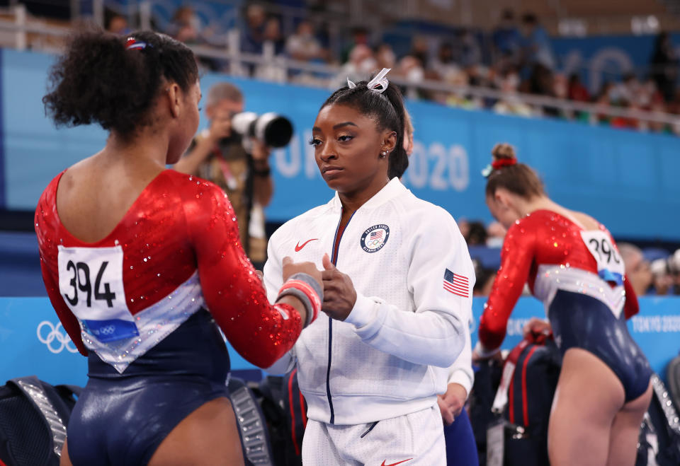 TOKYO, JAPAN - JULY 27: Simone Biles talks with Jordan Chiles of Team United States during the Women's Team Final on day four of the Tokyo 2020 Olympic Games at Ariake Gymnastics Centre on July 27, 2021 in Tokyo, Japan. (Photo by Laurence Griffiths/Getty Images)