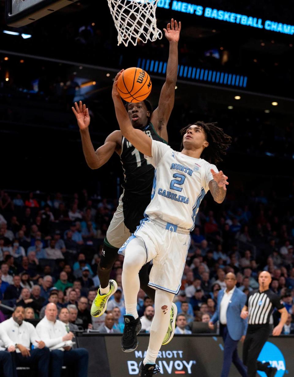 North Carolina’s Elliot Cadeau (2) attempts a layup against Wagner Thursday. A second later, though, the layup was blocked. Cadeau had zero points, a season low, in UNC’s first-round NCAA Tournament win.