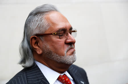 Vijay Mallya has a break outside the court house as he waits for his extradition case to be heard at Westminster Magistrates Court, in London, Britain, December 10, 2018. REUTERS/Peter Nicholls