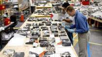 Members of the Columbia Reconstruction Project Team continue to examine and identify pieces of debris from Space Shuttle Columbia that were shipped to KSC May 13, 2003 at the Kennedy Space Center, Florida. The items at KSC number more than 82,000, weigh 84,800 pounds or 38 percent of the total dry weight of Columbia. (Photo by NASA/Getty Images)