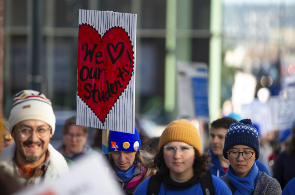 Striking Portland Public Schools teachers march along East Burnside St. after blocking traffic on the Burnside Bridge on Tuesday, Nov. 21, 2023 in Portland, Ore. Portland teachers have been on strike since Nov. 1. Students in Portland Public Schools, Oregon's largest district, have missed 11 days of class because of the walkout. (Dave Killen /The Oregonian via AP)