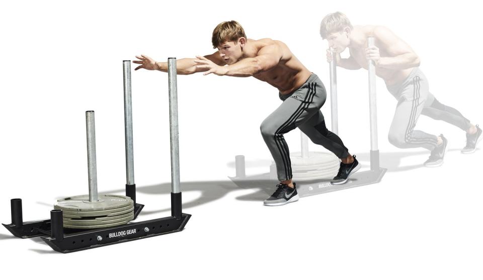 <p>Assume a sprint stance and grip <a href="https://www.menshealth.com/uk/building-muscle/a758276/the-best-equipment-youre-not-using-the-prowler/" rel="nofollow noopener" target="_blank" data-ylk="slk:the sled;elm:context_link;itc:0;sec:content-canvas" class="link ">the sled</a> with your arms bent and both hands at shoulder height, so the pipes are at your chest. Your torso should now be at roughly 45 degrees to the floor. From here, press the sled out explosively by extending your arms. Step forward and repeat.</p>