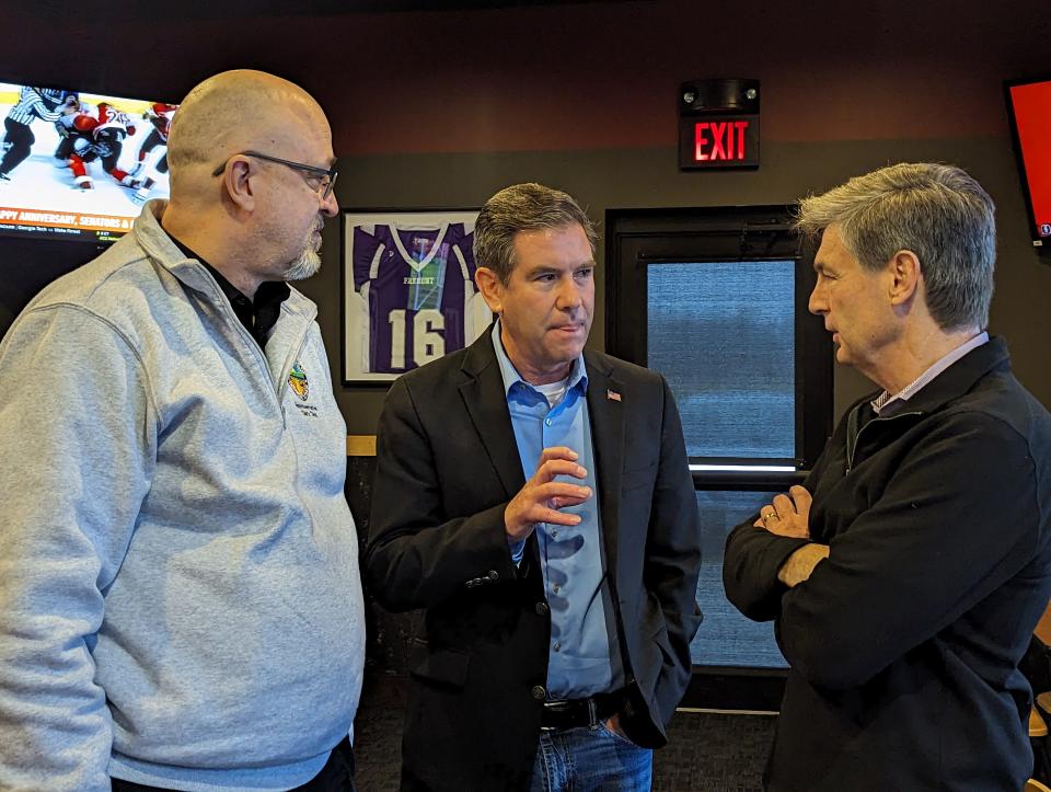 Ohio Rep. Gary Click, R-Vickery, left, and former Ohio Rep. Craig Riedel, middle, speak with Ohio Sen. Matt Dolan at the monthly Sandusky County Republican Party dinner on Tuesday. Click is running for reelection, while Riedel is running for Congress and Dolan for U.S. Senate.