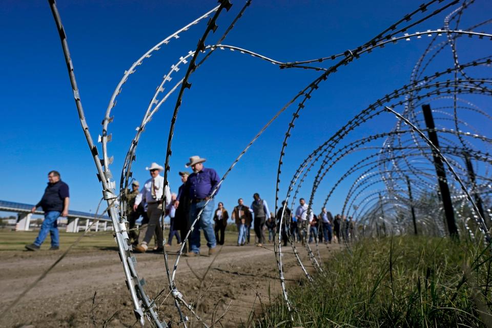 Concertina wire is seen Jan. 3 as Republican members of Congress tour the Texas-Mexico border in Eagle Pass, Texas. U.S. House Speaker Mike Johnson led about 60 fellow Republicans in Congress on a visit to the Mexican border.