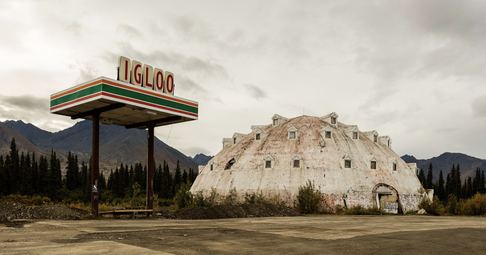 <p>The abandoned Igloo Hotel near Cantwell, Alaska, never actually opened for business, as various code violations and structural problems plagued the hotel from ever welcoming a single guest. </p><p>The building has sat empty for over half a century, but some that travel to Alaska's no-man's land to see the unique hotel claim to <a href="https://www.onlyinyourstate.com/alaska/ak-urban-legends/" rel="nofollow noopener" target="_blank" data-ylk="slk:catch a glimpse;elm:context_link;itc:0;sec:content-canvas" class="link ">catch a glimpse</a> of the woman in white who supposedly haunts the desolate ruin.</p>