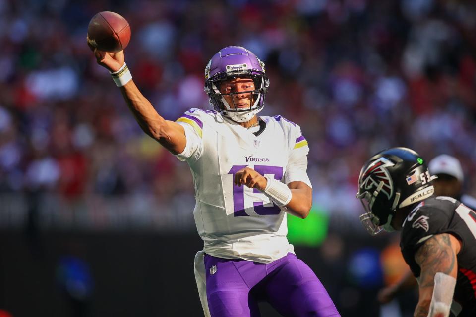 Minnesota Vikings quarterback Joshua Dobbs (15) throws a pass against the Atlanta Falcons in the second half at Mercedes-Benz Stadium.