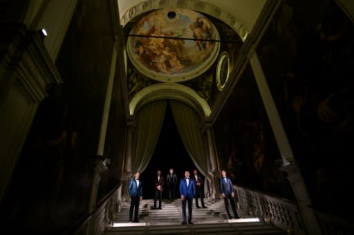 Models posing at Venice's Scuola Grande di San Rocco showed off sharply tailored gear -- but the severe flooding in the city meant they could have done with rain boots too, creative director Filippo Ricci joked