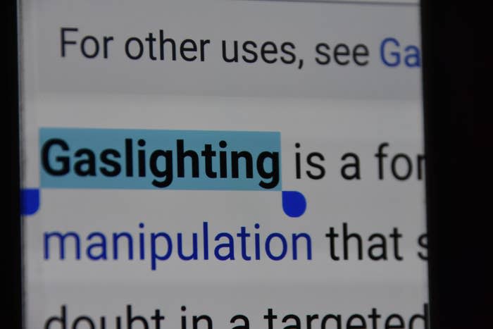 A close-up of a computer screen with the word "gaslighting" highlighted