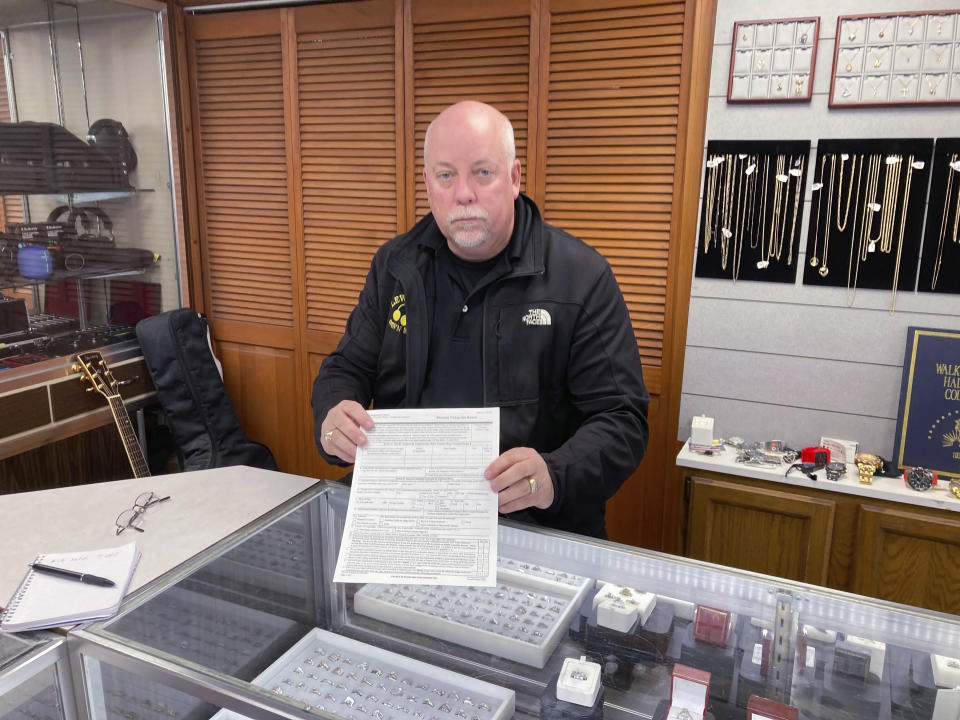 Rick LaChapelle speaks during an interview at his store in Brunswick, Maine, Monday, Oct. 30, 2023. LaChapelle discussed his staff declining to release a gun suppressor in August to Robert Card, the man authorities have identified as the gunman in the shooting that left 18 dead in Lewiston. (AP Photo/Jake Bleiberg)