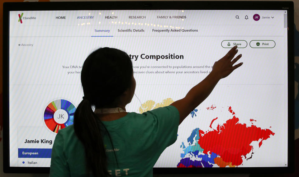 An attendee interacts with a display at the 23andMe booth at the RootsTech annual genealogical event in Salt Lake City, Utah, U.S., February 28, 2019.  REUTERS/George Frey