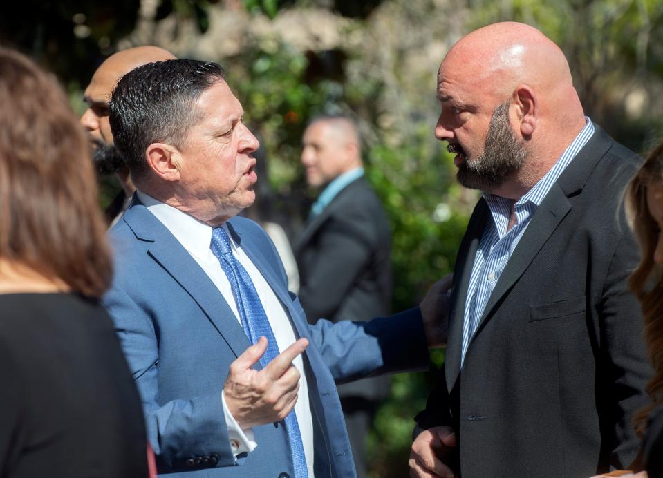 San Joaquin County District Attorney Ron Freitas, left, talks with Chris Rouppet at the San Joaquin County Hispanic Chamber of Commerce's 20th annual Latina Business Conference and Luncheon at the Wine and Roses Inn in Lodi on Friday, Mar. 24, 2023.