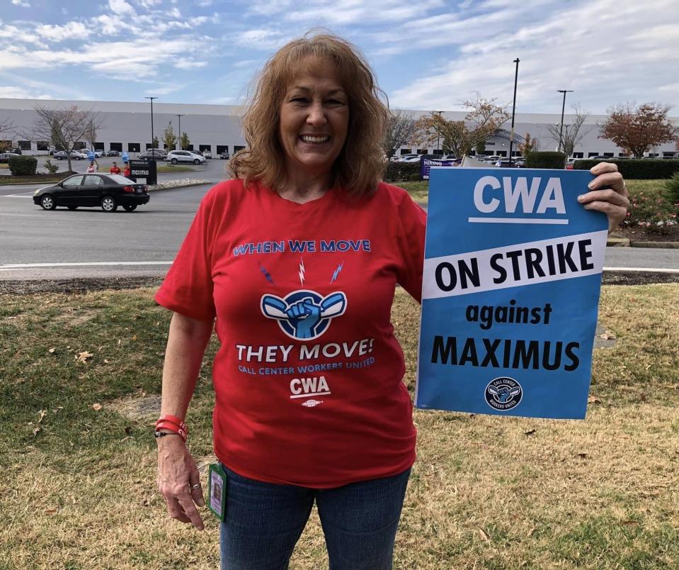 Barbara Westbrook, a Chester Maximus employee, holds a sign during the labor strike on November 9.