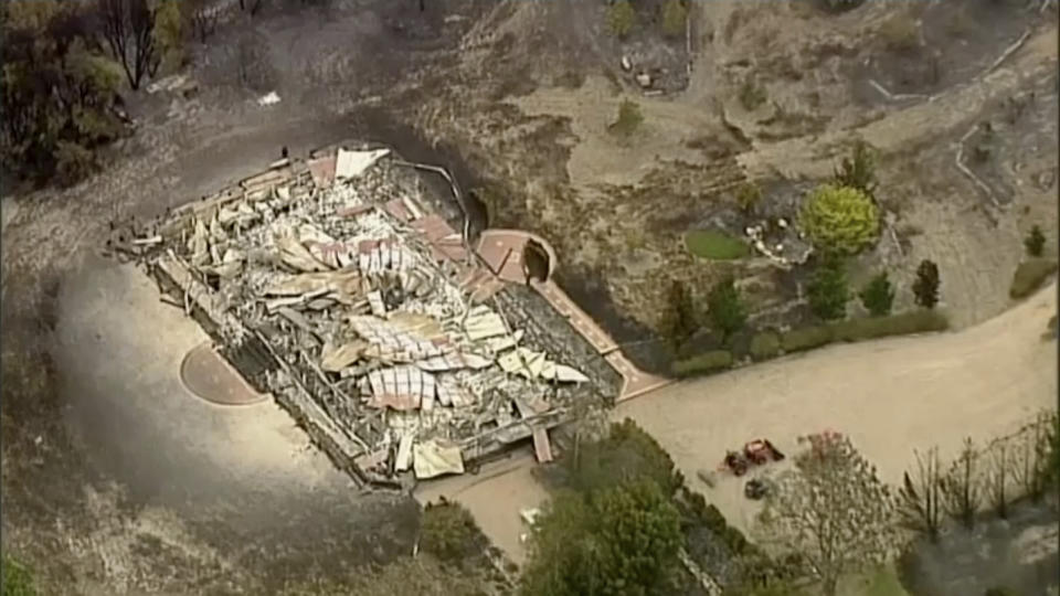 In this image made from video, an aerial scene shows destroyed homes and properties after a wildfire in East Grippsland, Victoria, Tuesday, Dec. 31, 2019. Wildfires burning across Australia's two most-populous states Tuesday trapped residents of a seaside town in apocalyptic conditions, destroyed many properties. (Australian Broadcasting Corporation, Channel 7, Channel 9 via AP)