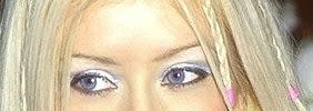 Crop of Christina Aguilera's eye with her wearing frosty blue eyeshadow