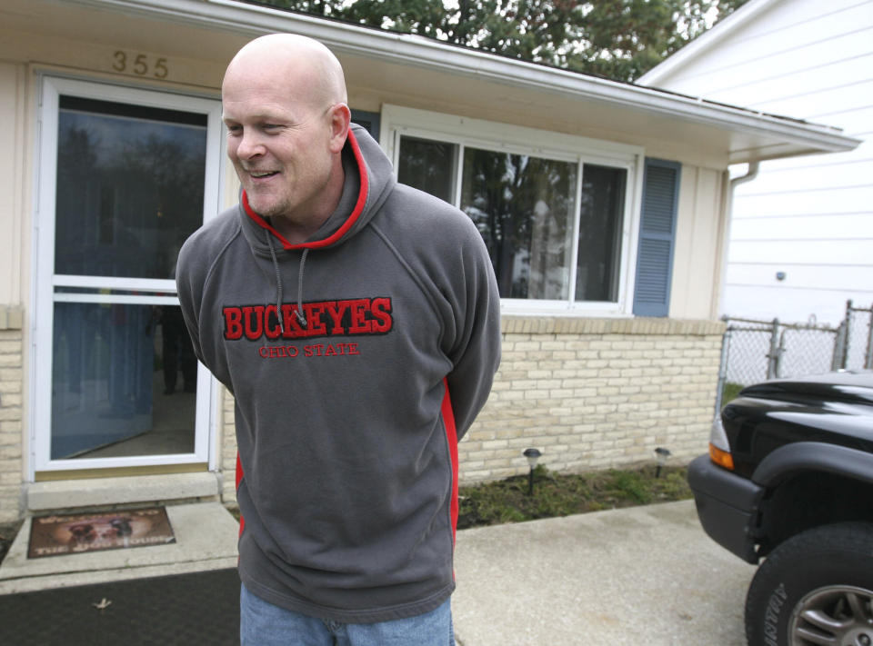 FILE - Joe Wurzelbacher, also known as "Joe the Plumber," laughs while talking outside of his home in Holland, Ohio, Oct. 16, 2008. Wurzelbacher, who was thrust into the political spotlight as “Joe the Plumber” after questioning Barack Obama about his economic policies during the 2008 presidential campaign, has died, his son said Monday, Aug. 28, 2023. He was 49. His oldest son, Joey Wurzelbacher, said his father died Sunday, Aug. 27, in Wisconsin after a long illness. (AP Photo/Madalyn Ruggiero, File)