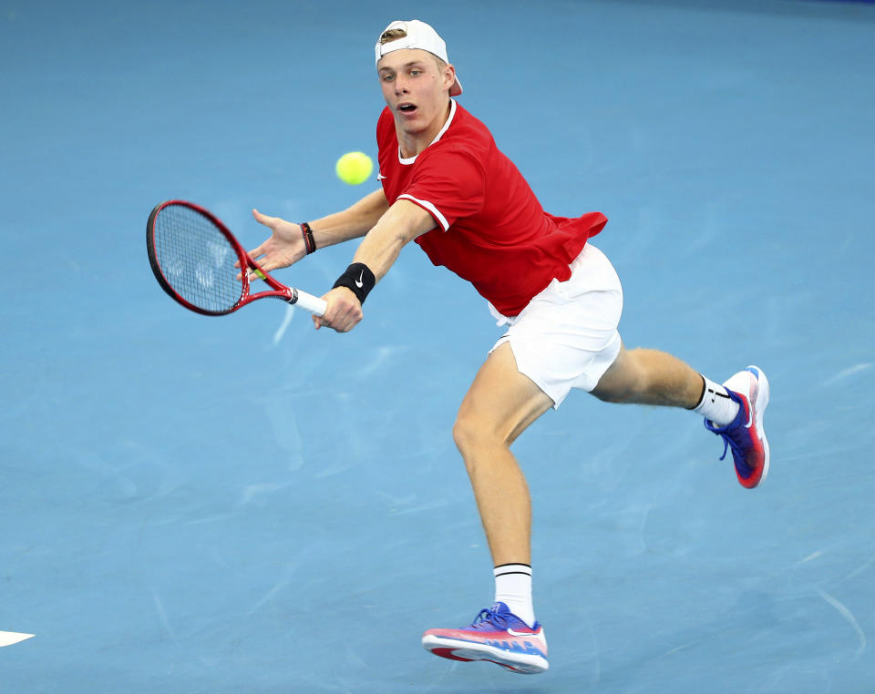 Denis Shapovalov of Canada plays a shot during his match against Alex de Minaur of Australia at the ATP Cup tennis tournament in Brisbane, Australia, Sunday, Jan. 5, 2020. (AP Photo/Tertius Pickard)