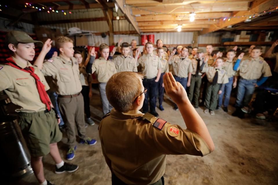 In this Thursday, Dec. 12, 2019 photo, a Boy Scouts troop gathers during their meeting, in Kaysville, Utah.