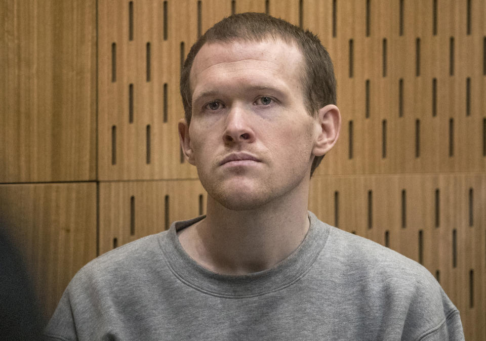 Australian Brenton Harrison Tarrant, 29, sits in the dock on the final day of his sentencing hearing at the Christchurch High Court after pleading guilty to 51 counts of murder, 40 counts of attempted murder and one count of terrorism in Christchurch, New Zealand, Thursday, Aug. 27, 2020. The white supremacist who killed 51 worshippers at two New Zealand mosques in March 2019 was sentenced to life in prison without parole. (John Kirk-Anderson/Pool Photo via AP)