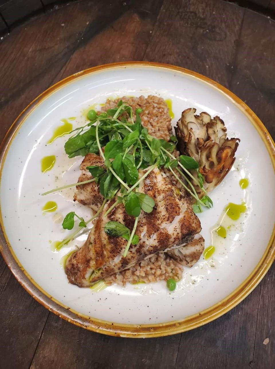Vesta Wood-Fired's dish of walleye, created by its chef, Christine Nunn, with English peas, toasted farro risotto with a pea tendril salad and candied lemon vinaigrette.