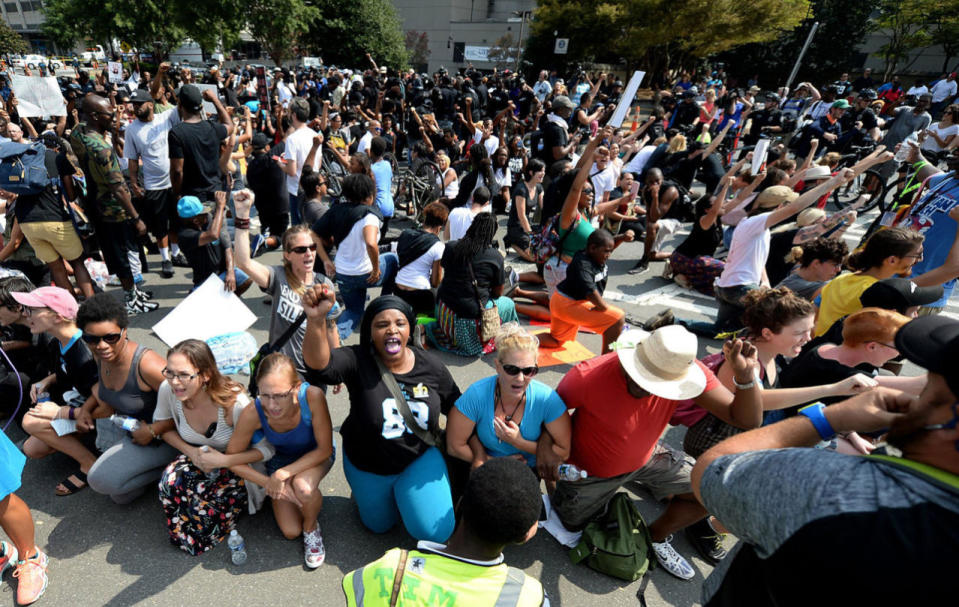 <p>Somerotesters take a knee outside Bank of America Stadium as the national anthem is sung prior to an NFL football game between the Minnesota Vikings and the Carolina Panthers in Charlotte, N.C., Sunday, Sept. 25, 2016. (Jeff Siner/The Charlotte Observer via AP)</p>